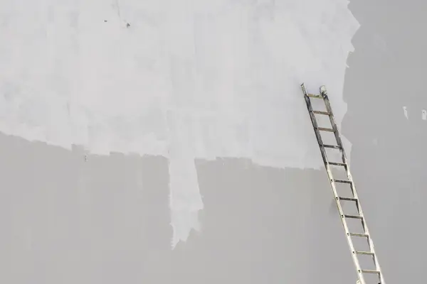 Exterior painting in Anchorage: ladder against a freshly primed wall